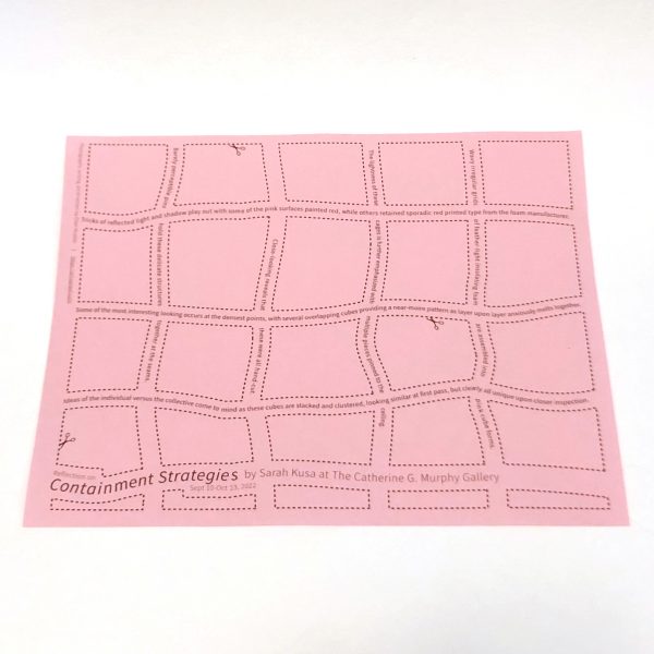pink sheet of paper with red printing