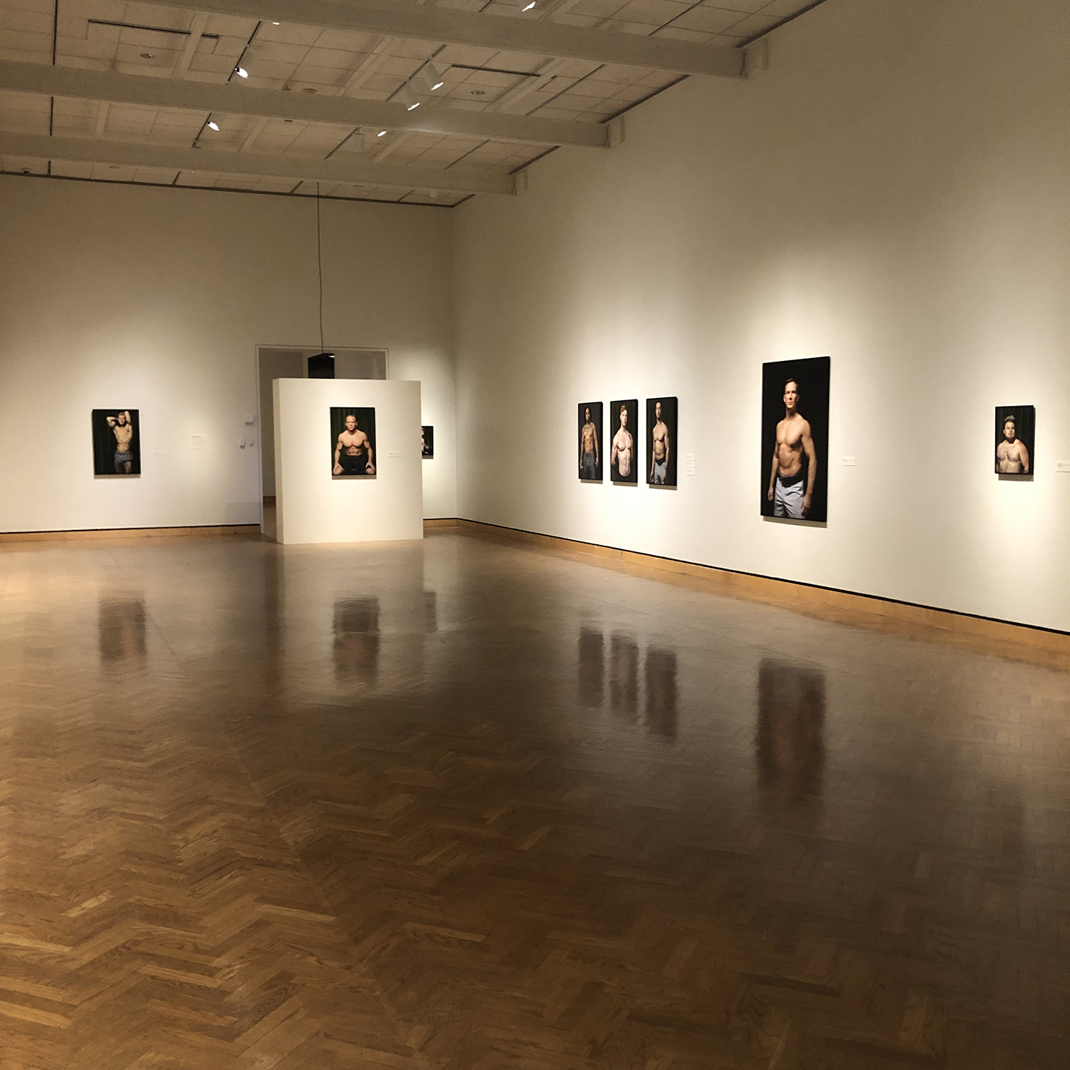 view of large gallery with photographs on walls