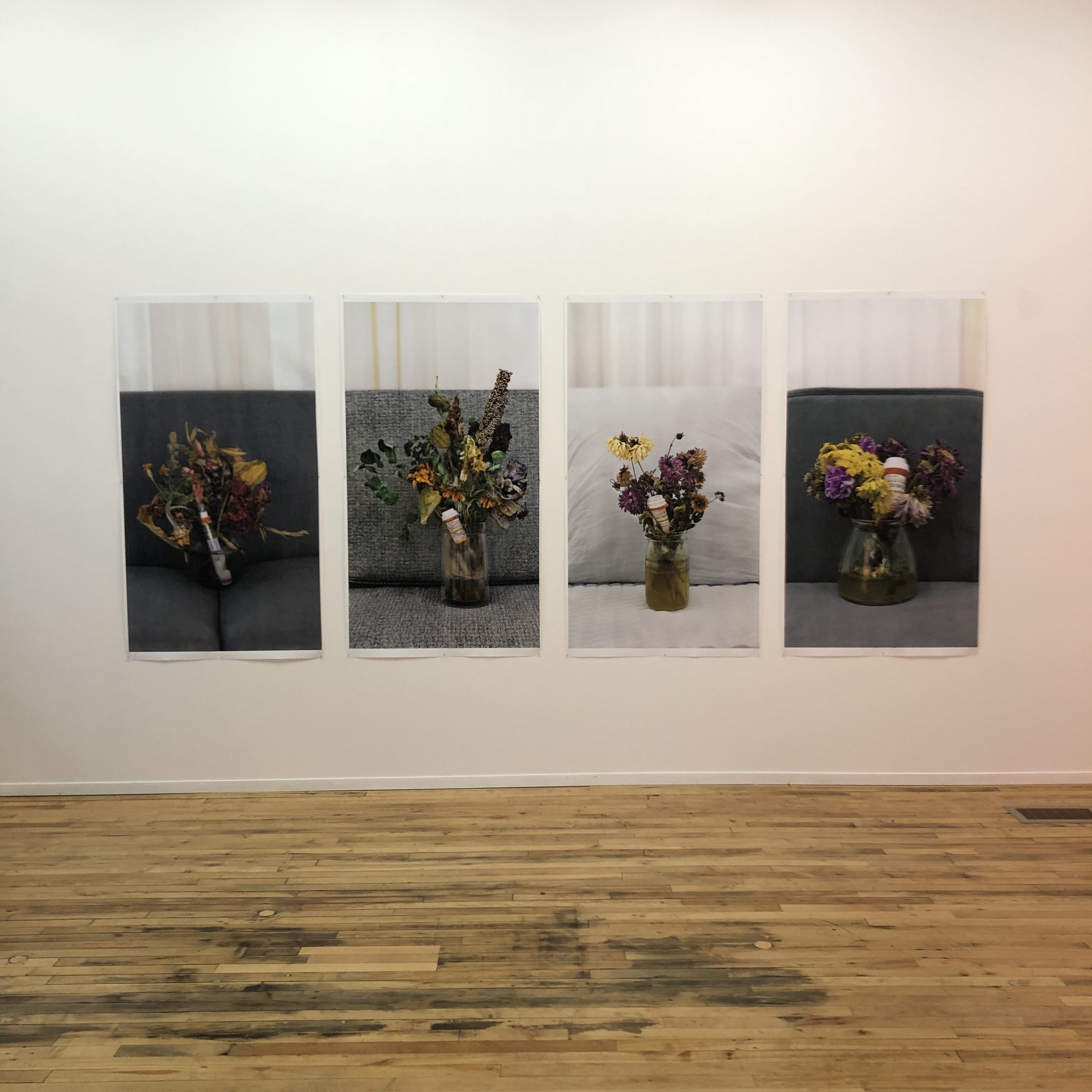 4 photos of dying flowers hanging on a wall 